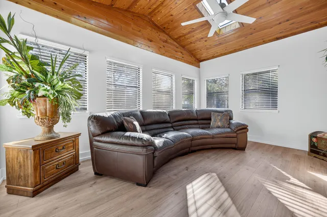 a view of a house with swimming pool and a yard
