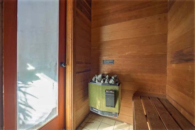 a view of a patio with table and chairs with wooden floor and fence