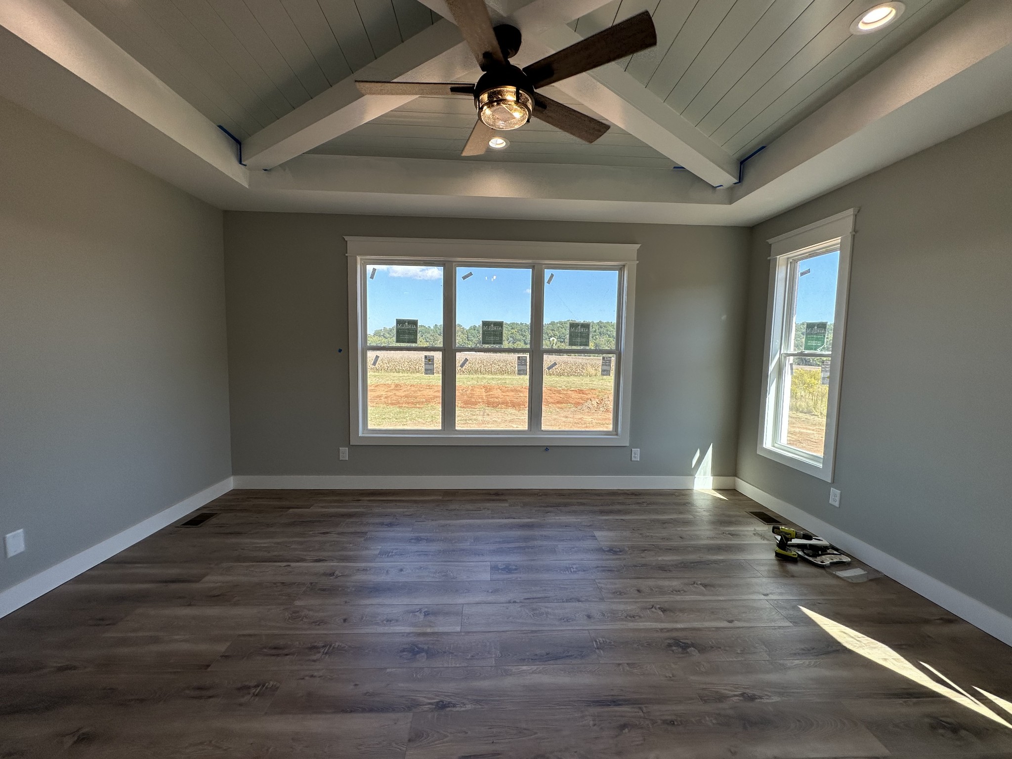 285 Aplin Branch Road Cottontown, TN 37048 - Photo 23 of 70 an empty room with wooden floor and windows