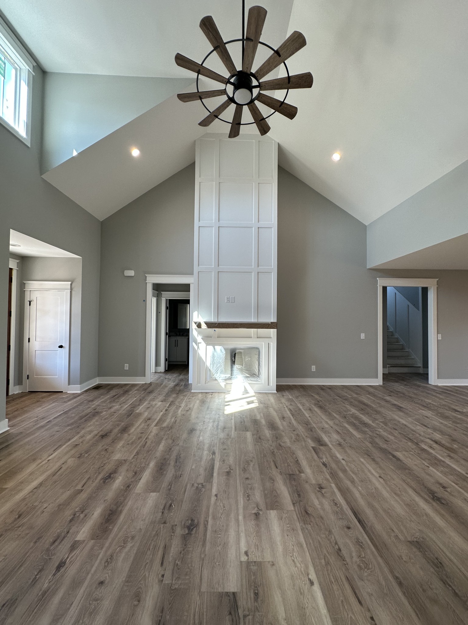 285 Aplin Branch Road Cottontown, TN 37048 - Photo 4 of 70 a view of empty room with wooden floor and ceiling fan