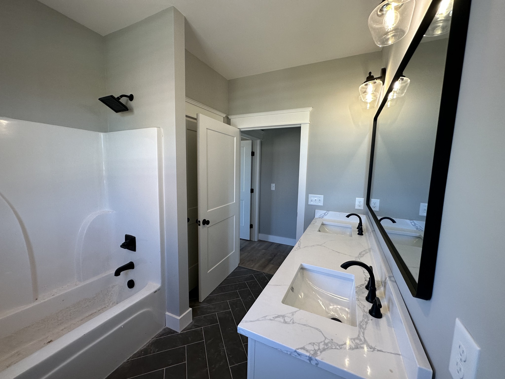 285 Aplin Branch Road Cottontown, TN 37048 - Photo 48 of 70 a bathroom with a tub sink and mirror