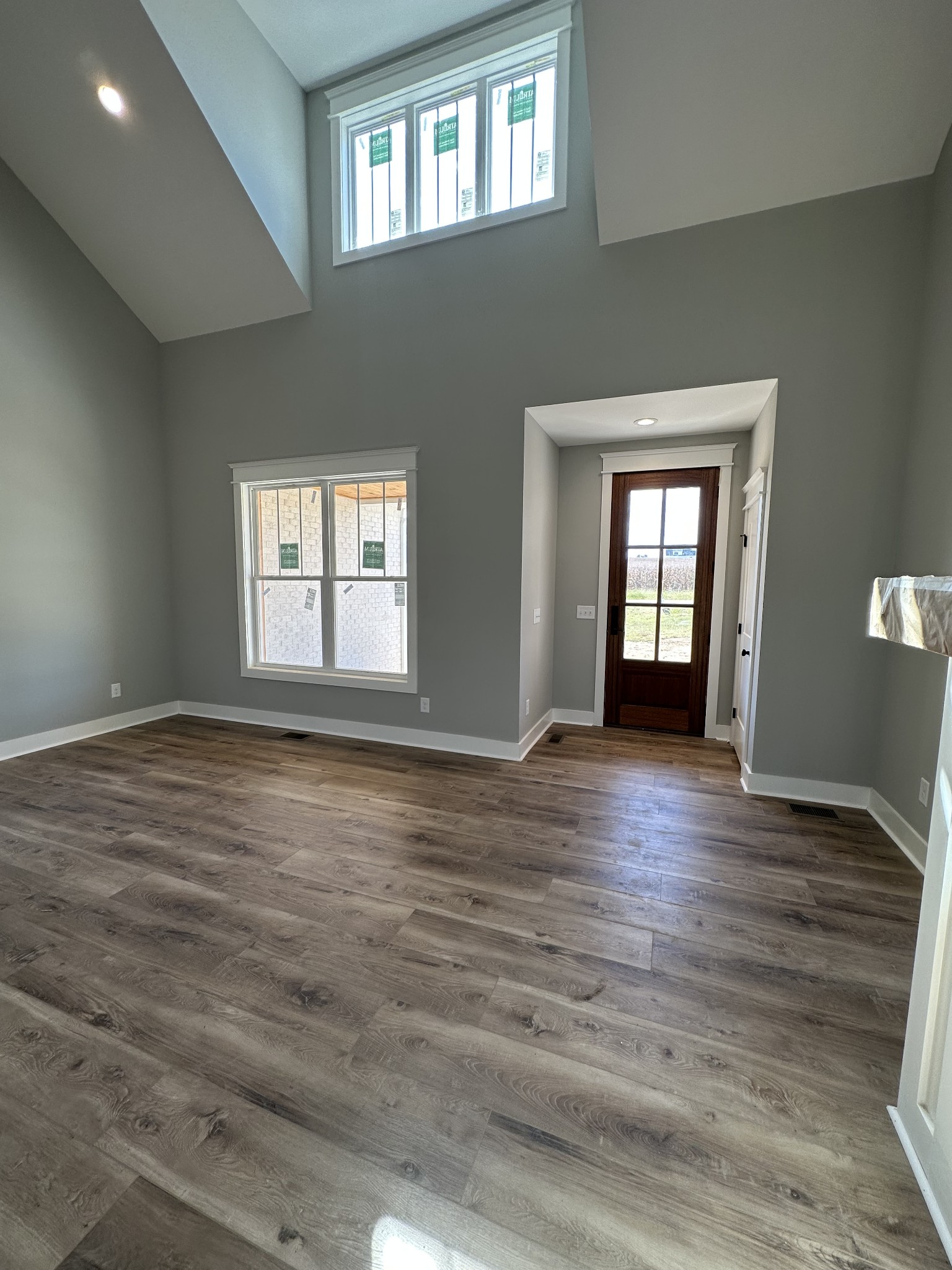 285 Aplin Branch Road Cottontown, TN 37048 - Photo 5 of 70 a view of empty room with wooden floor and fan