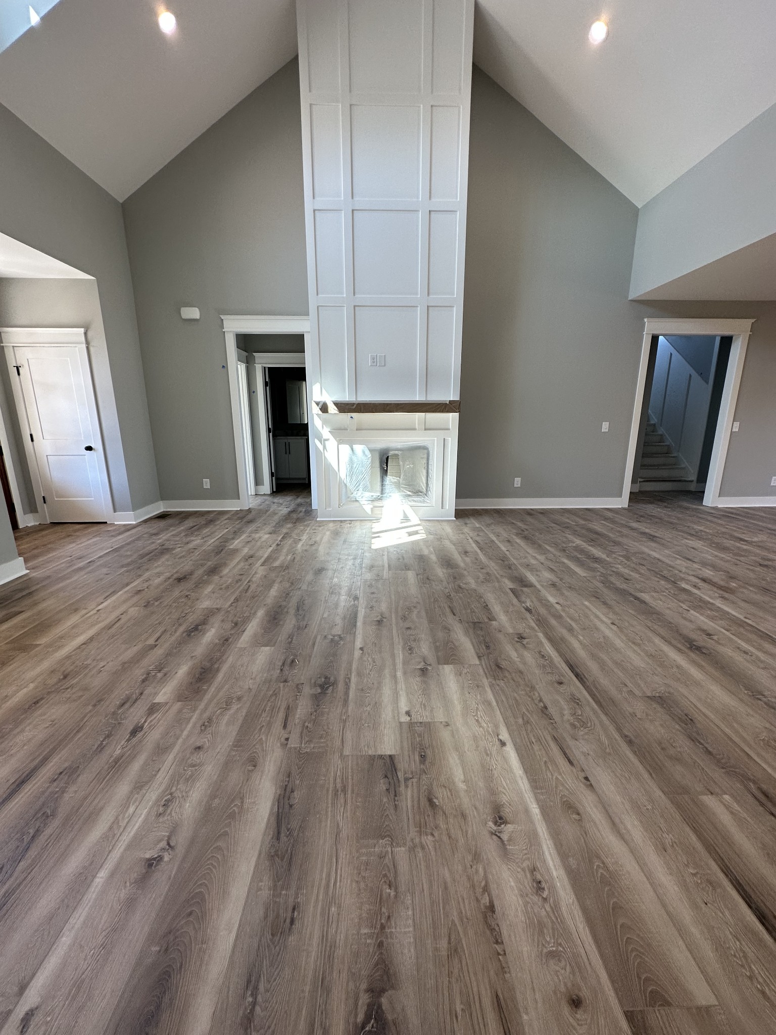 285 Aplin Branch Road Cottontown, TN 37048 - Photo 6 of 70 a view of empty room with wooden floor and fireplace