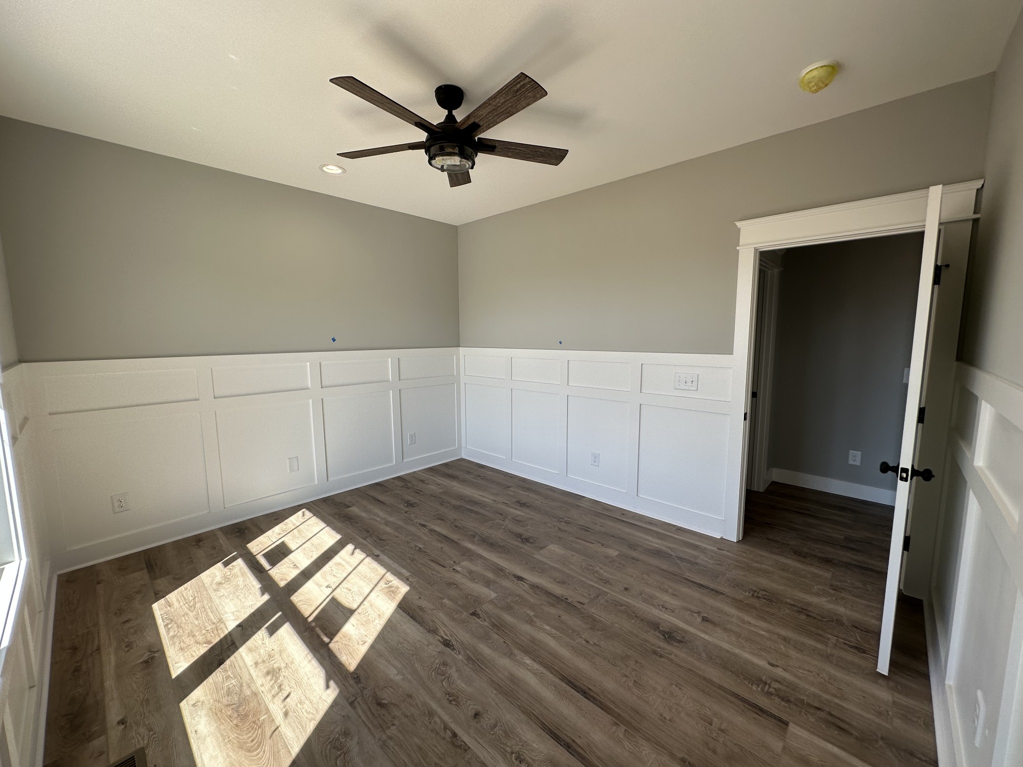 285 Aplin Branch Road Cottontown, TN 37048 - Photo 9 of 70 a view of empty room with wooden floor and fan