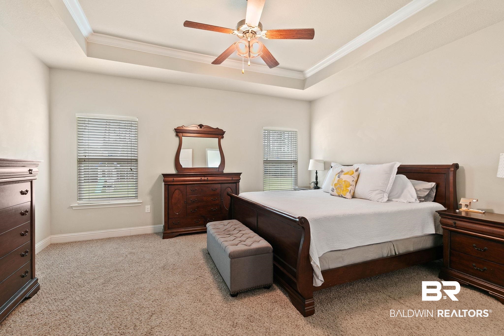 12750 B Jenkins Pit Road Daphne, AL 36527 - Photo 31 of 89 Bedroom featuring ornamental molding, light carpet, a ceiling fan, and a tray ceiling