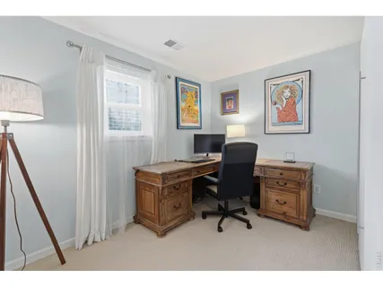 a workspace with furniture and window
