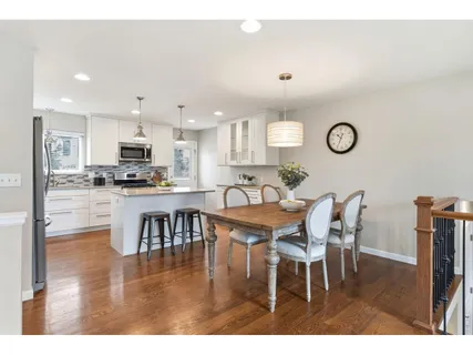 a view of kitchen with dining table and chairs