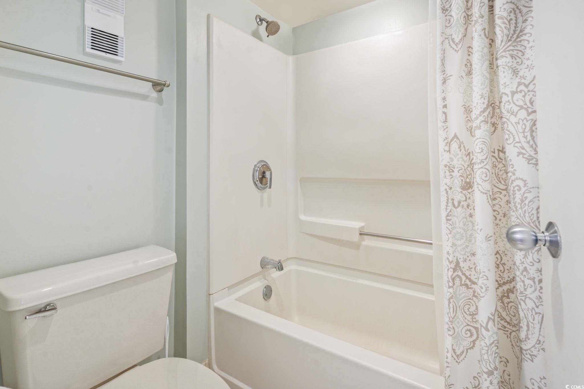 9820 Queensway Boulevard, Unit 1005 Myrtle Beach, SC 29572 - Photo 15 of 24 Bathroom with shower / tub combo and toilet