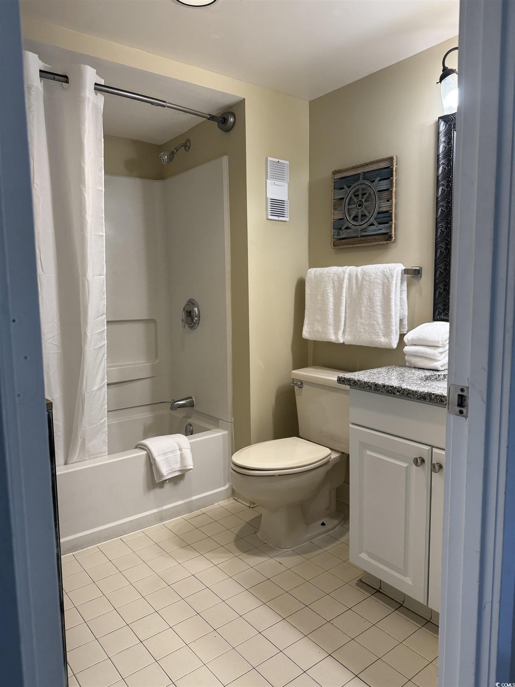 9820 Queensway Boulevard, Unit 1005 Myrtle Beach, SC 29572 - Photo 17 of 24 Bathroom featuring shower / tub combo, light tile