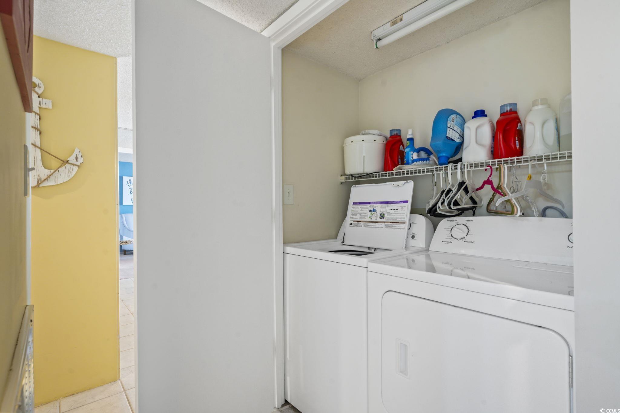 9820 Queensway Boulevard, Unit 1005 Myrtle Beach, SC 29572 - Photo 18 of 24 Laundry area featuring washing machine and dryer,