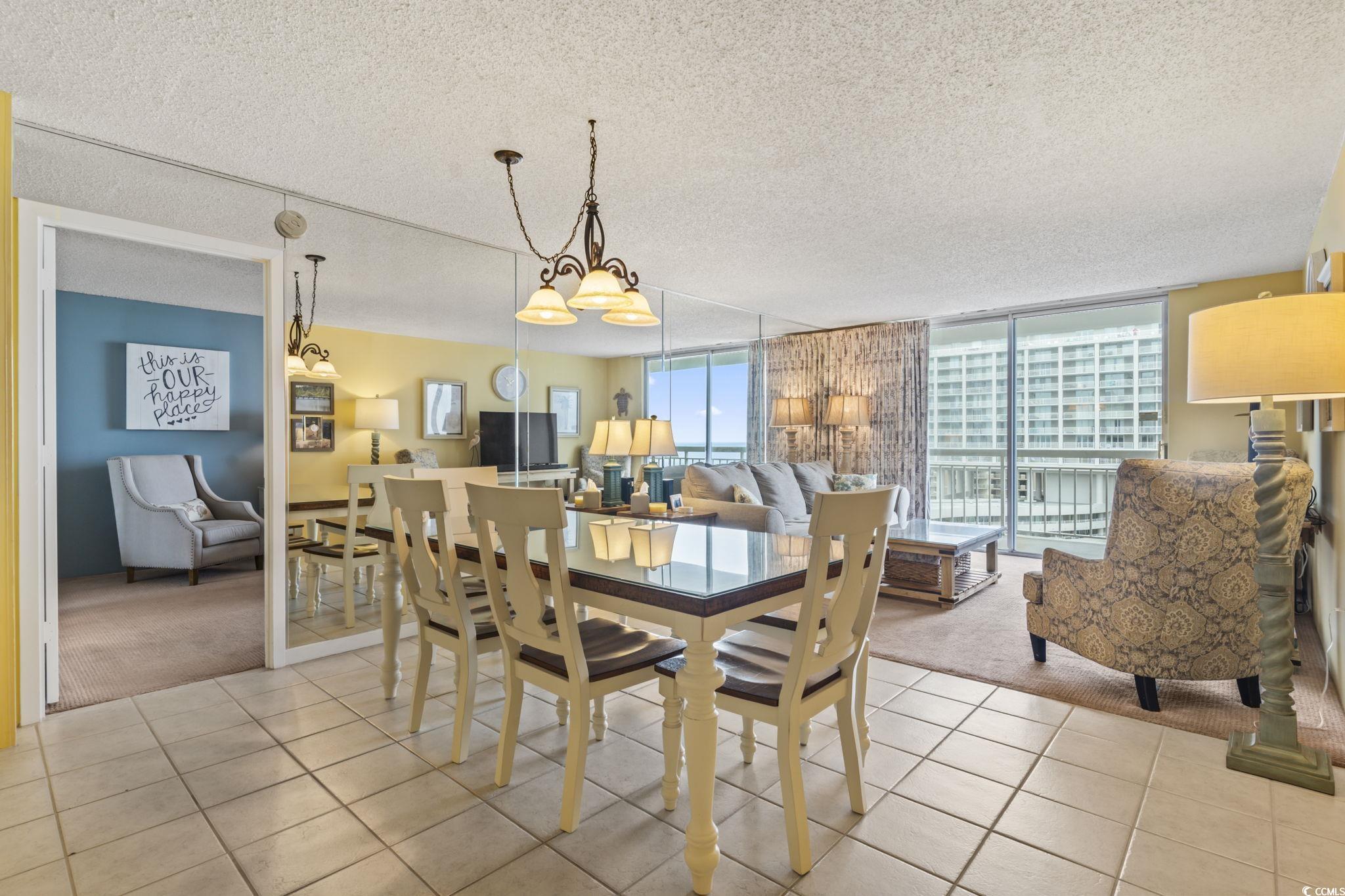9820 Queensway Boulevard, Unit 1005 Myrtle Beach, SC 29572 - Photo 6 of 24 Dining space with a textured ceiling, light colore