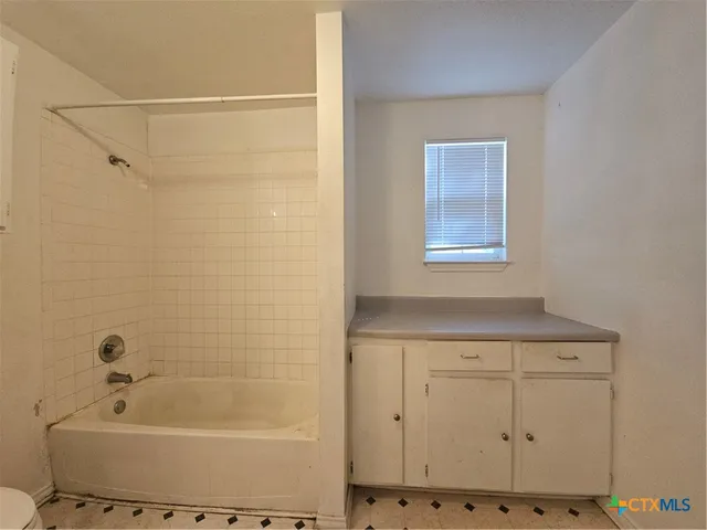 a bathroom with a bathtub
