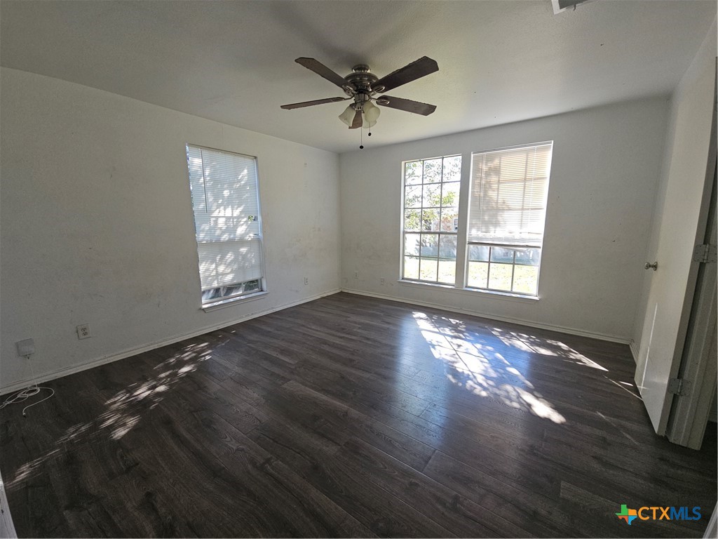 1001 South 29th Street Temple, TX 76504 - Photo 13 of 14 a view of an empty room with wooden floor and a window
