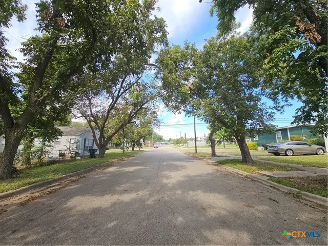 a view of road with trees