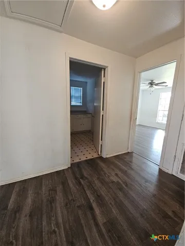 a view of wooden floor in an empty room