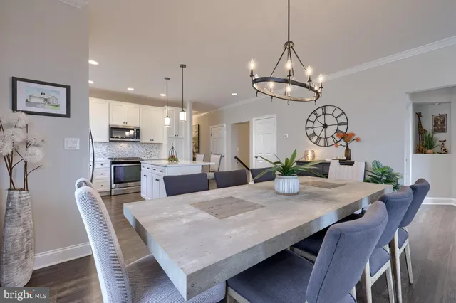 a living room with fireplace furniture and a wooden floor
