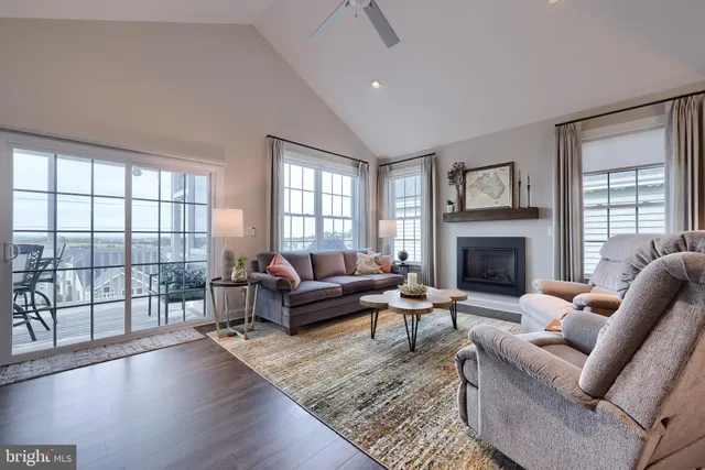 a view of a balcony with wooden floor and fence