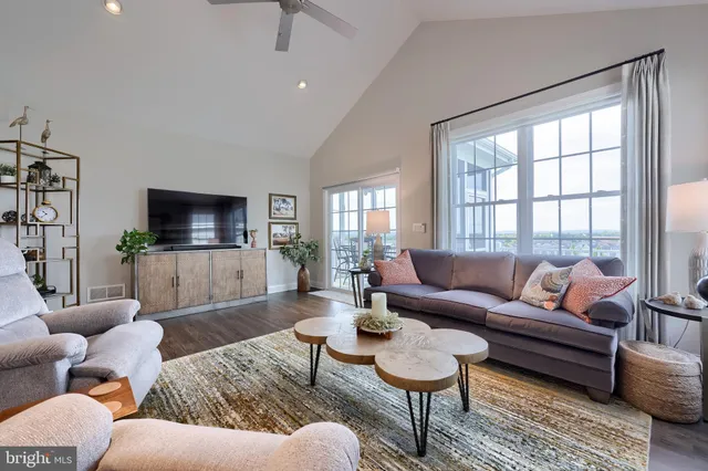 a bedroom with a bed dresser and window