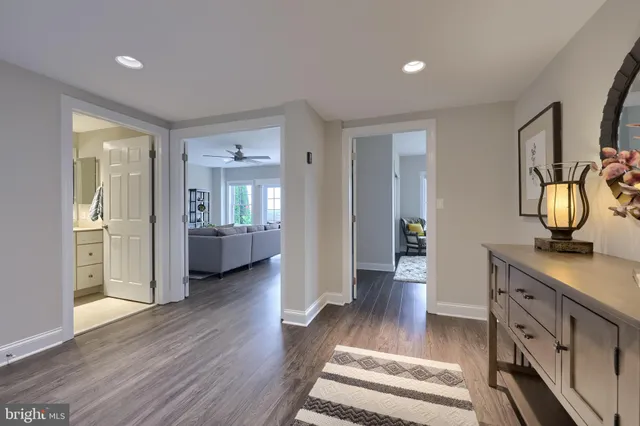 a view of a house with a big yard and large trees