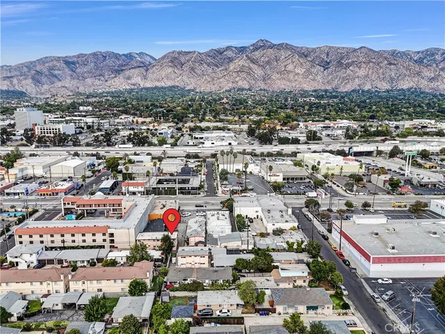 an aerial view of residential houses and outdoor space