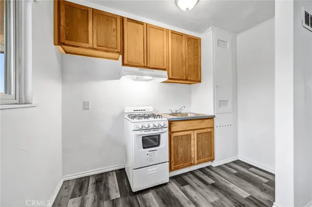 a kitchen with a stove and a microwave