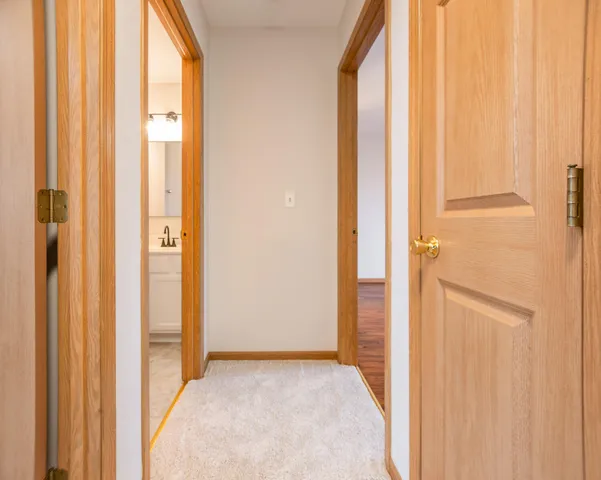 a view of a bathroom with shower and a window