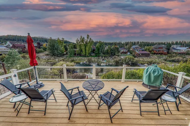 a view of a chairs and table in patio