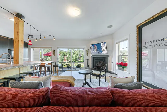 a bedroom with furniture and a fireplace