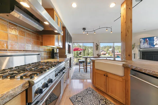 a kitchen with stove and cabinets