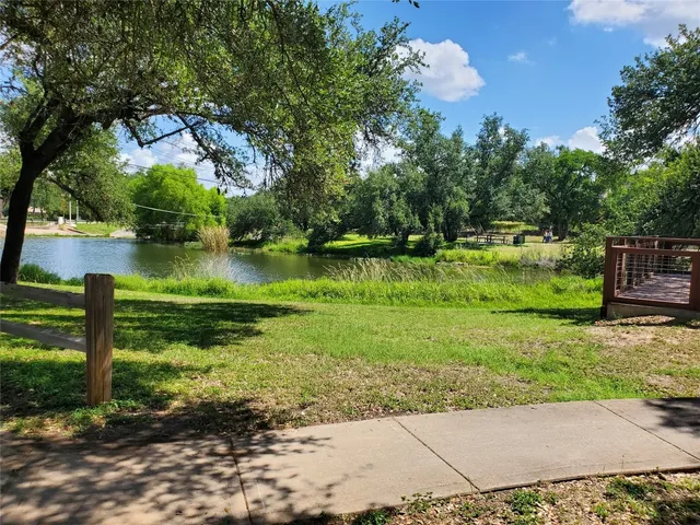 a backyard of a house with a garden and plants