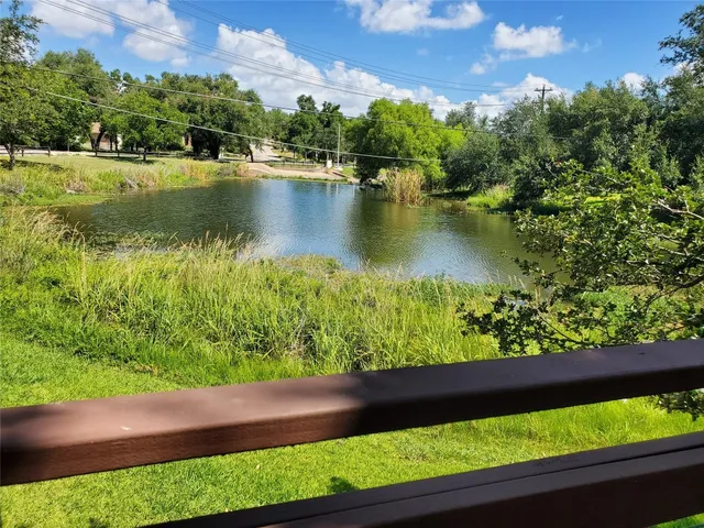 an aerial view of a houses with a yard