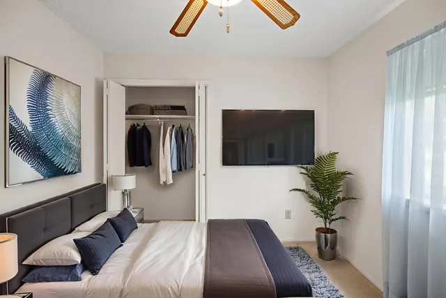 a bathroom with a sink and a mirror with toilet