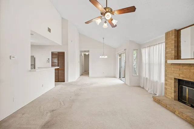 a view of a room with large windows