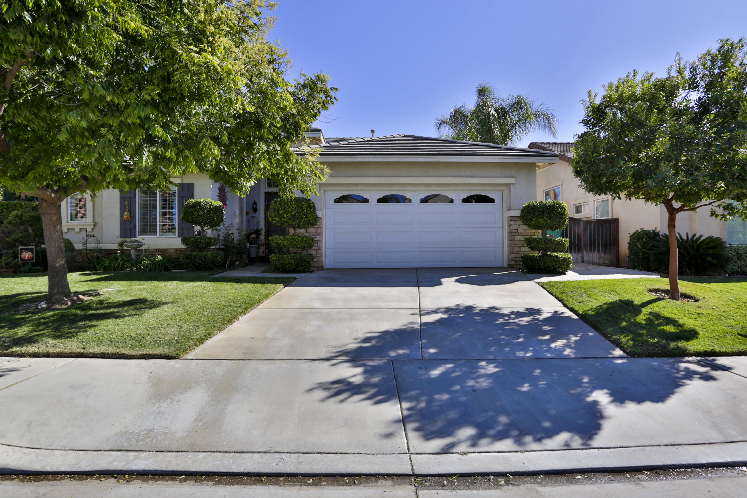 1598 Thunderbird Road Beaumont, CA 92223 - Photo 1 of 52 a front view of a house with a yard and a garage