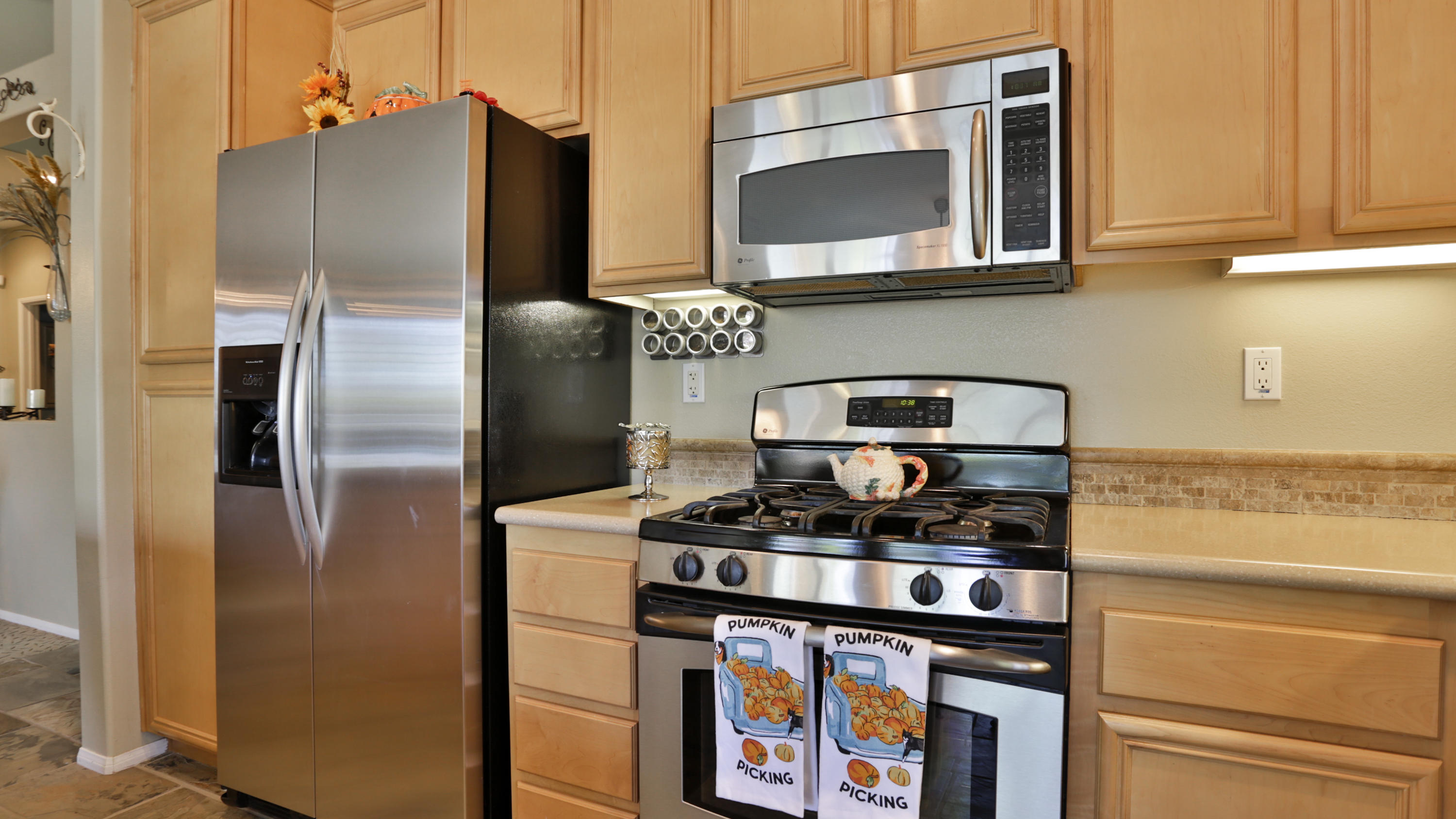1598 Thunderbird Road Beaumont, CA 92223 - Photo 12 of 52 a kitchen with stainless steel appliances granite countertop a refrigerator and a stove