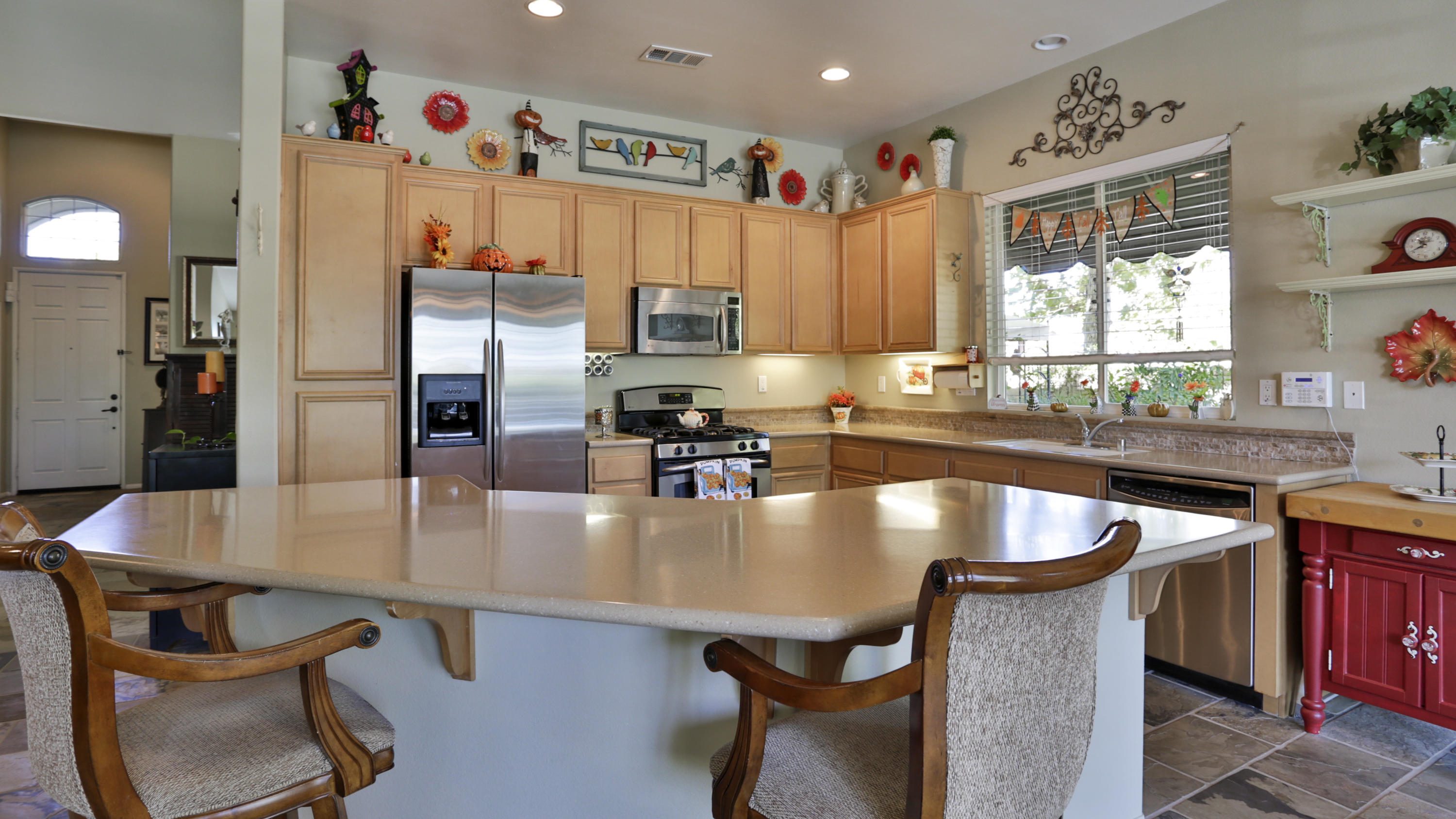 1598 Thunderbird Road Beaumont, CA 92223 - Photo 13 of 52 a kitchen with stainless steel appliances granite countertop a sink a stove and a refrigerator