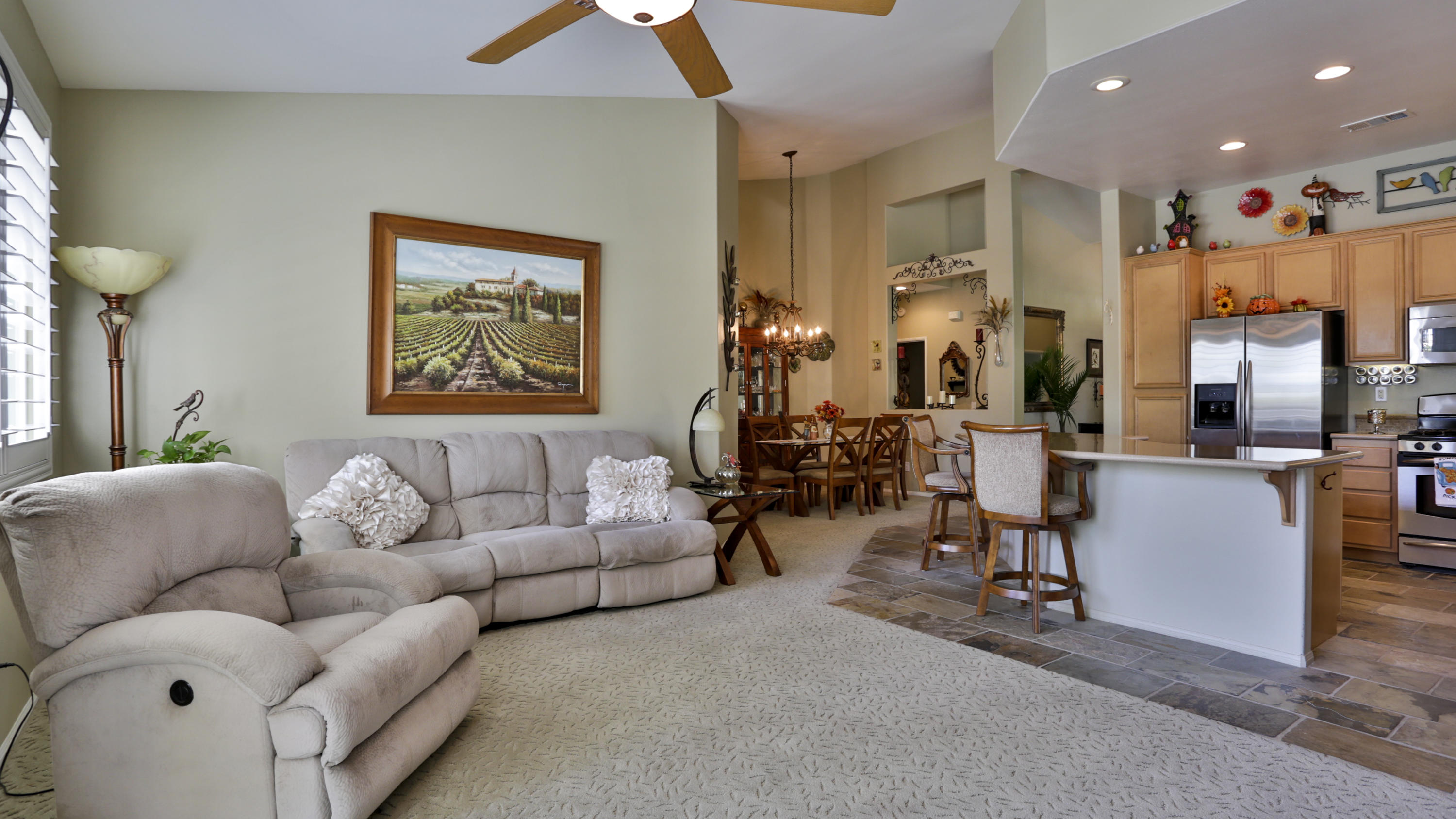 1598 Thunderbird Road Beaumont, CA 92223 - Photo 14 of 52 a living room with furniture kitchen view and a chandelier
