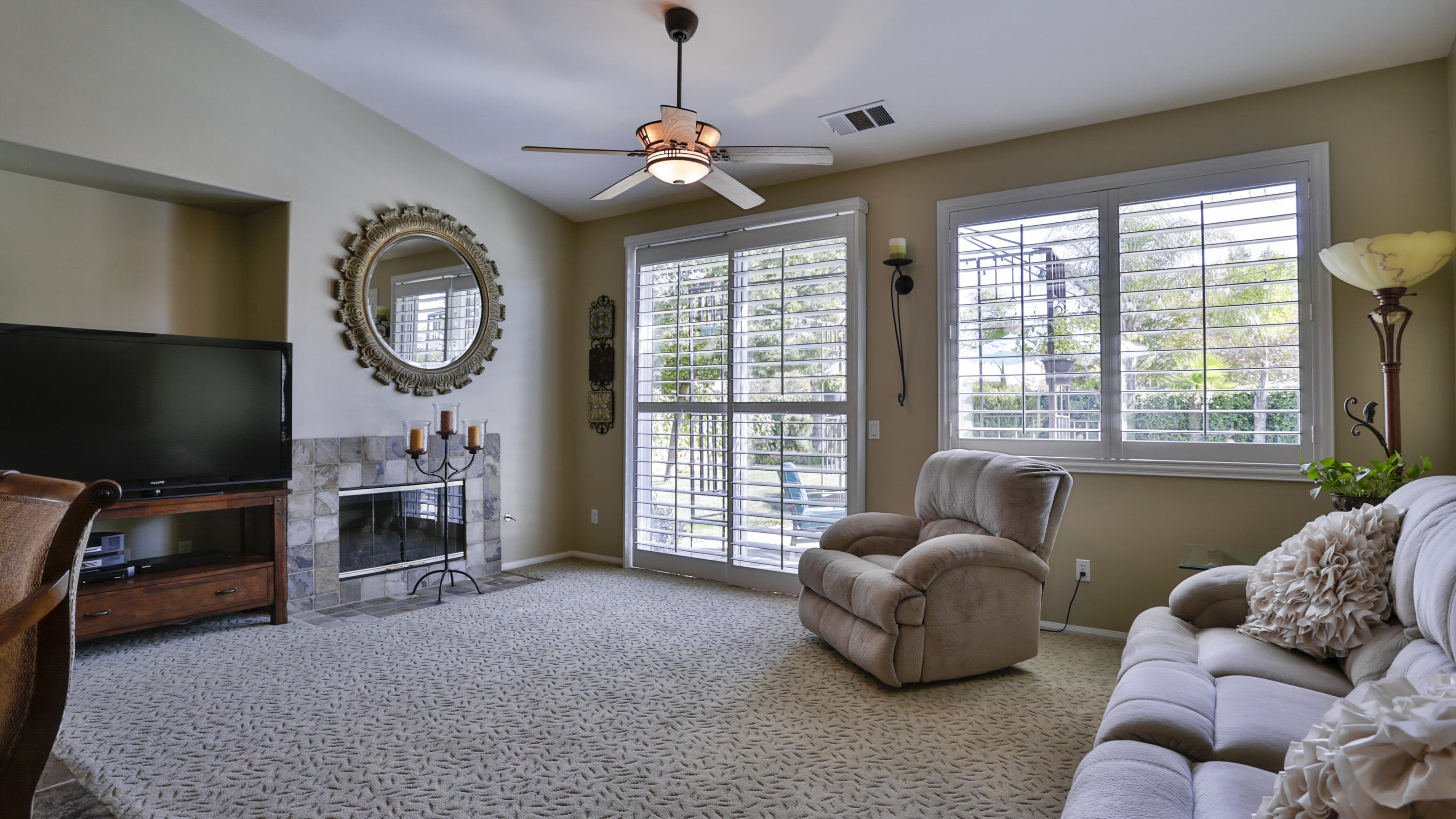 1598 Thunderbird Road Beaumont, CA 92223 - Photo 15 of 52 a living room with furniture and a flat screen tv