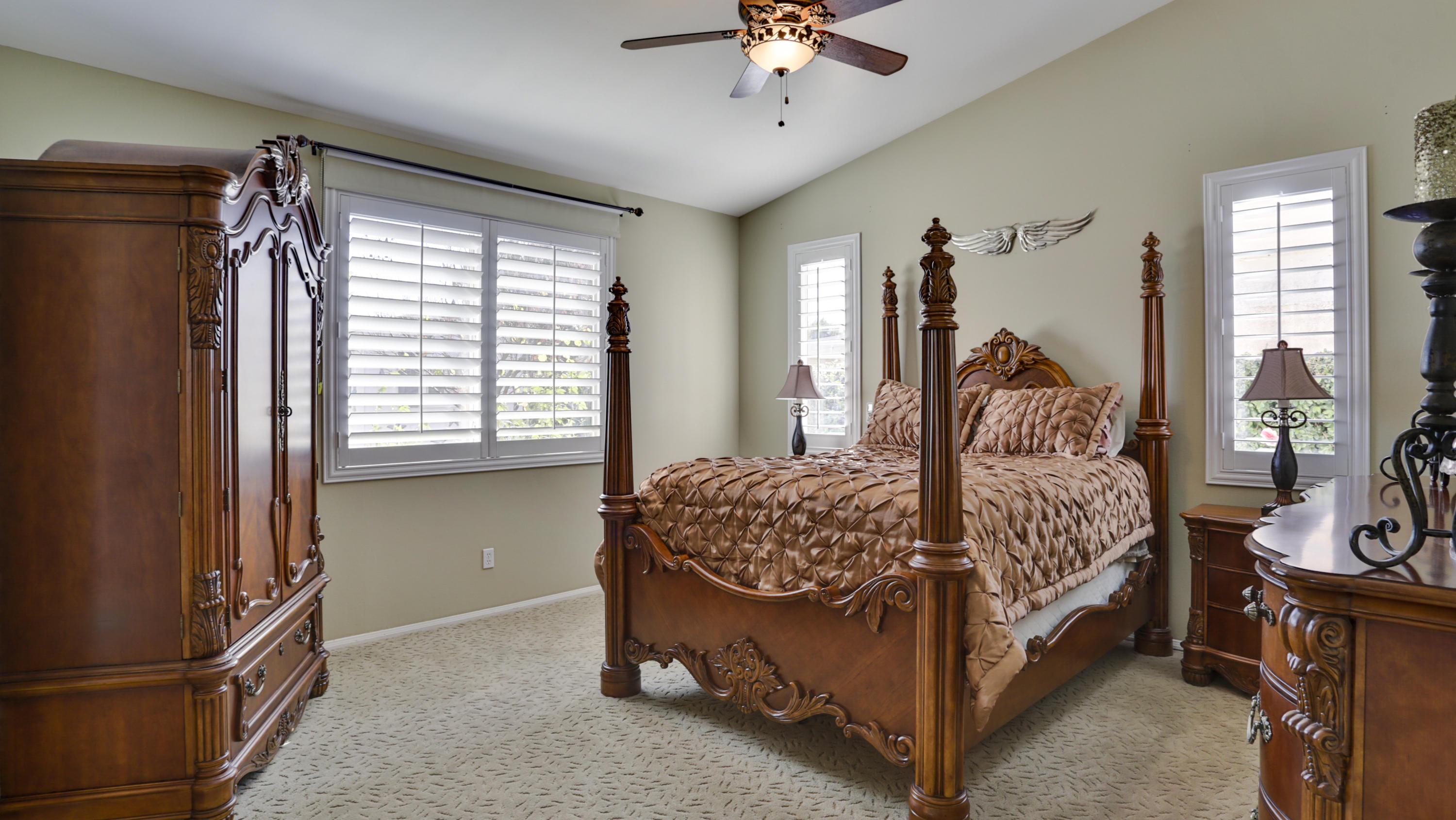 1598 Thunderbird Road Beaumont, CA 92223 - Photo 17 of 52 a bedroom with a bed and a chandelier