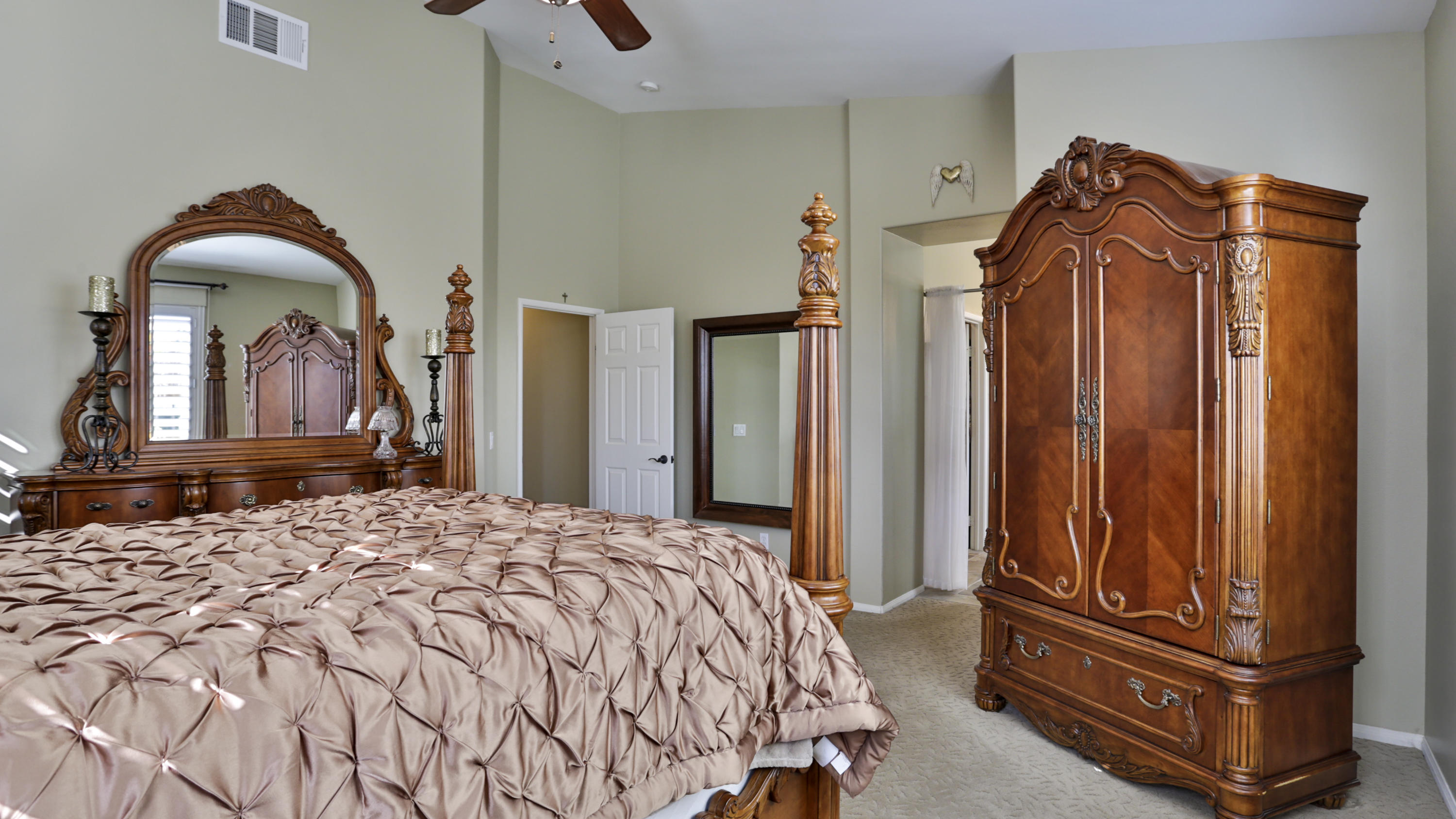 1598 Thunderbird Road Beaumont, CA 92223 - Photo 18 of 52 a bedroom with a bed and a mirror on dresser