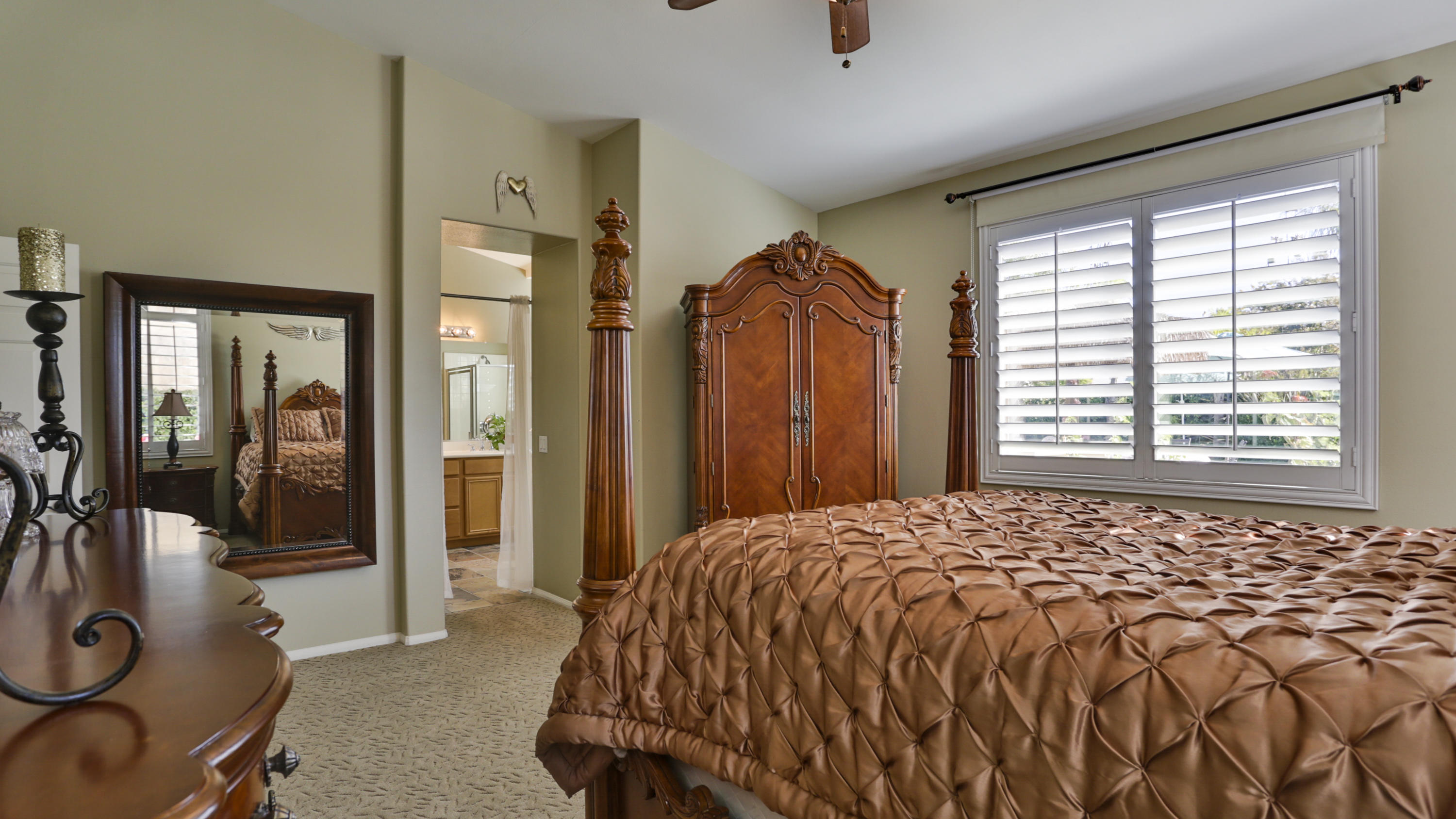 1598 Thunderbird Road Beaumont, CA 92223 - Photo 19 of 52 a bed sitting in a bedroom next to a window