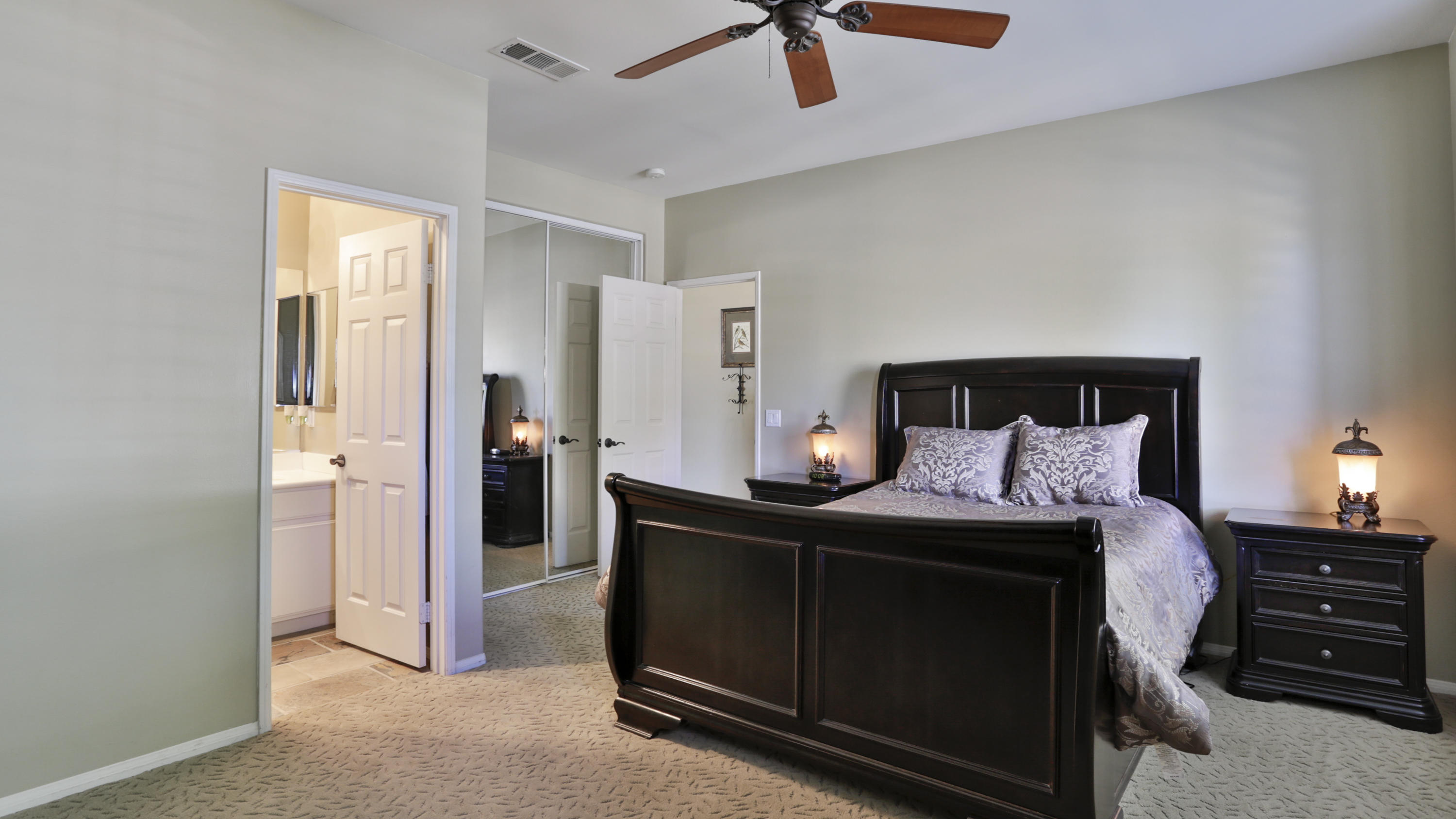 1598 Thunderbird Road Beaumont, CA 92223 - Photo 24 of 52 a bedroom with a bed and a chandelier