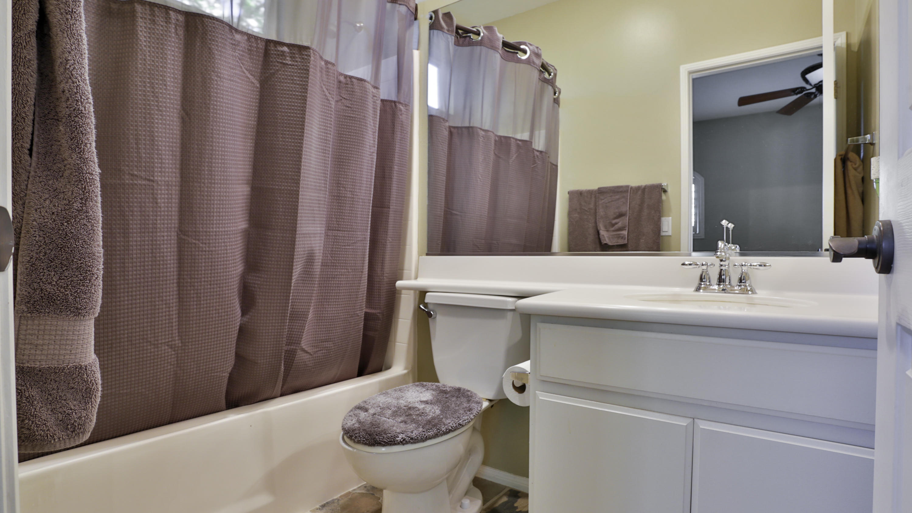 1598 Thunderbird Road Beaumont, CA 92223 - Photo 27 of 52 a bathroom with a sink toilet and shower