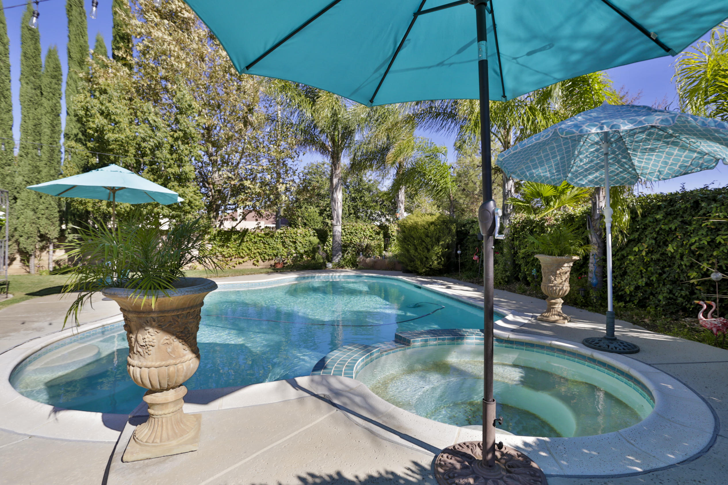 1598 Thunderbird Road Beaumont, CA 92223 - Photo 36 of 52 a view of a patio with table and chairs under an umbrella