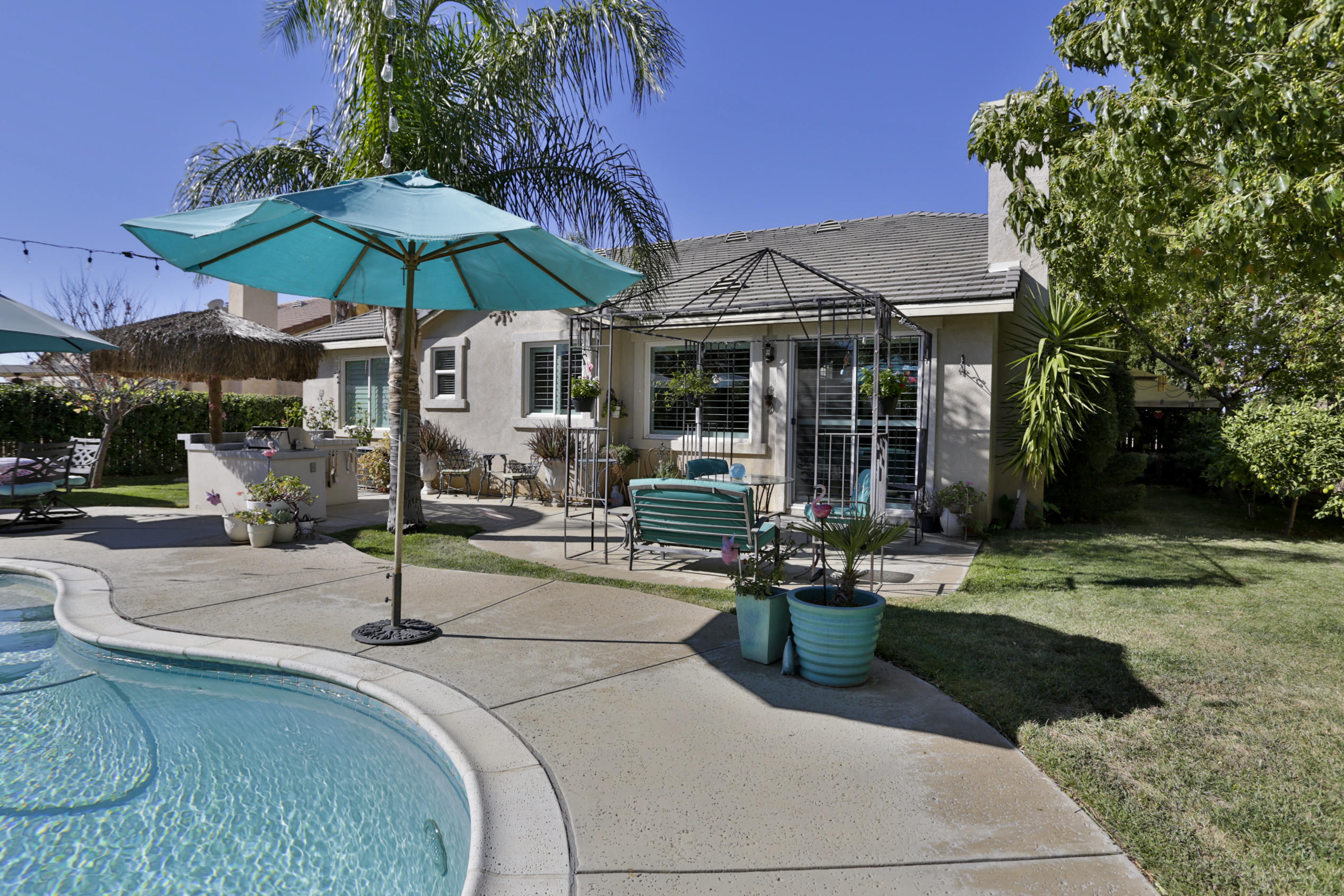 1598 Thunderbird Road Beaumont, CA 92223 - Photo 40 of 52 a view of a table and chairs under an umbrella