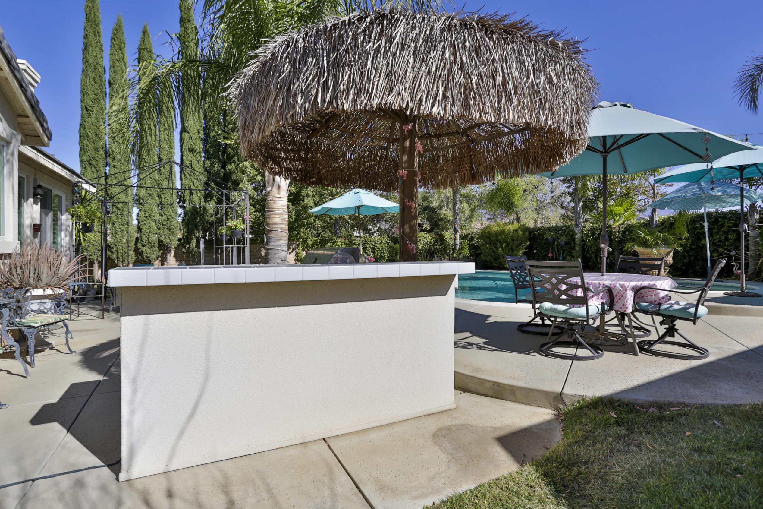 1598 Thunderbird Road Beaumont, CA 92223 - Photo 47 of 52 a view of a patio with table and chairs under an umbrella