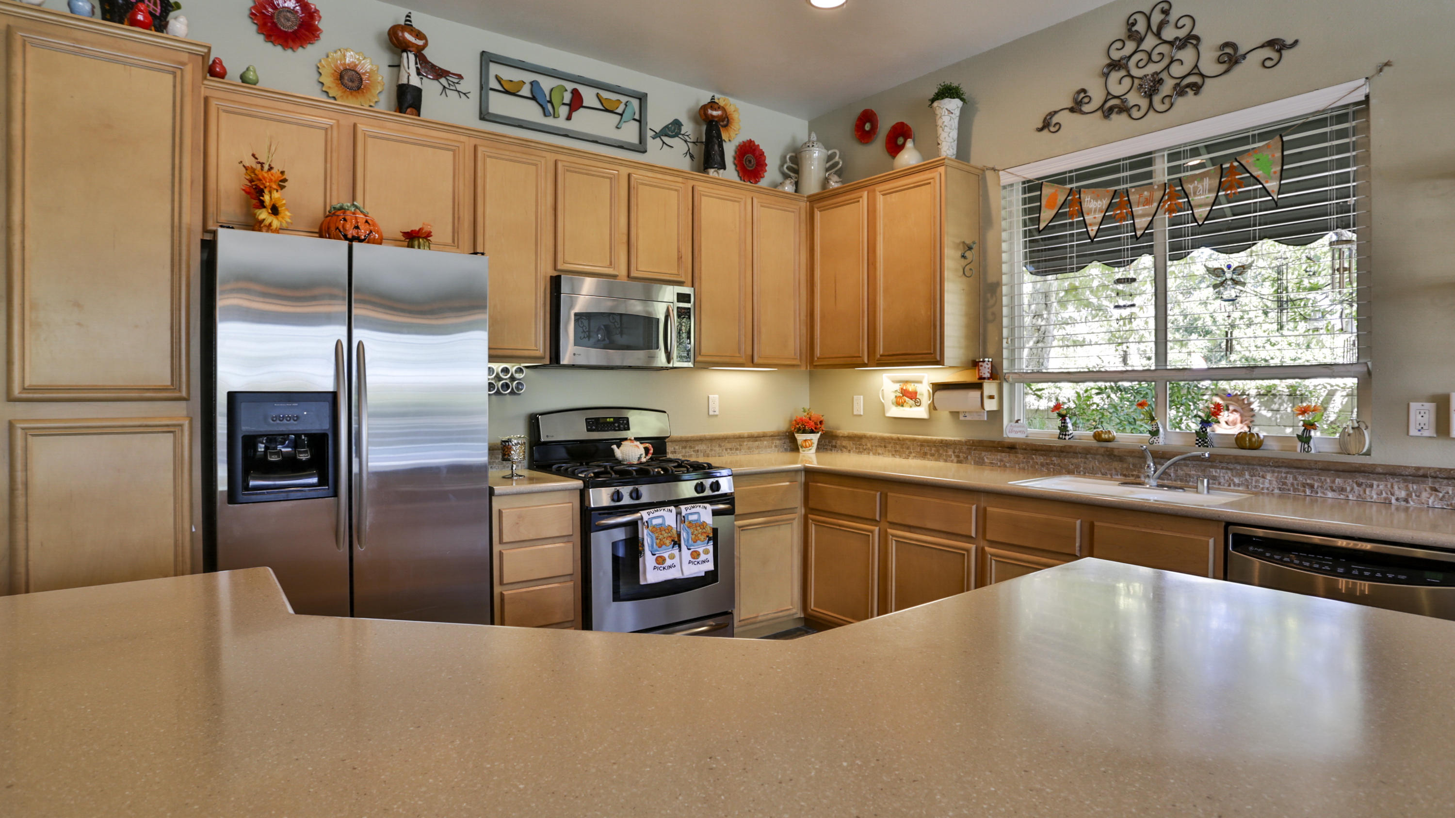 1598 Thunderbird Road Beaumont, CA 92223 - Photo 9 of 52 a kitchen with granite countertop a refrigerator and a sink