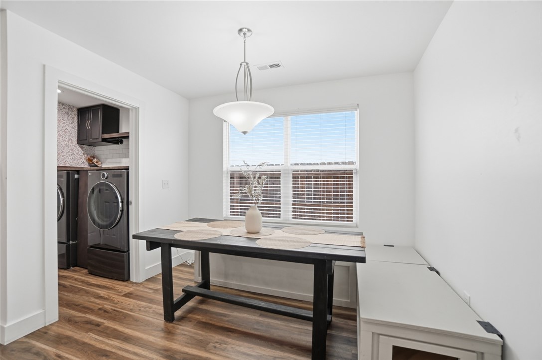 728 East Northern Avenue Springfield, OH 45503 - Photo 13 of 35 This dining area features durable flooring, a bright window, and convenient access to a laundry space.