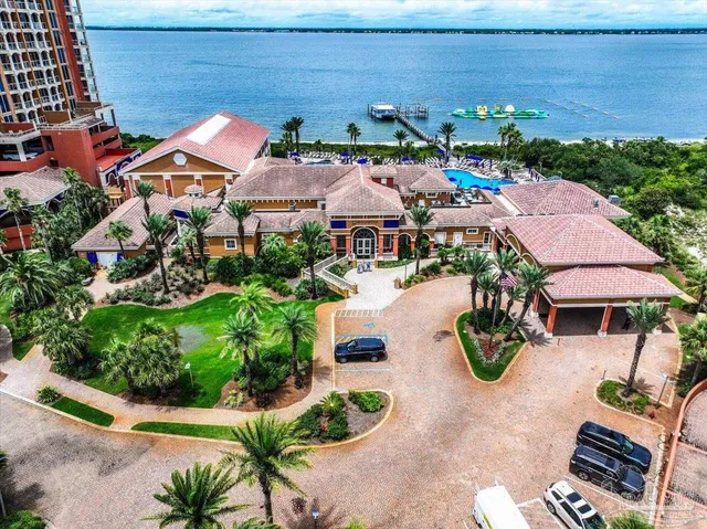 an aerial view of a house with garden space and street view