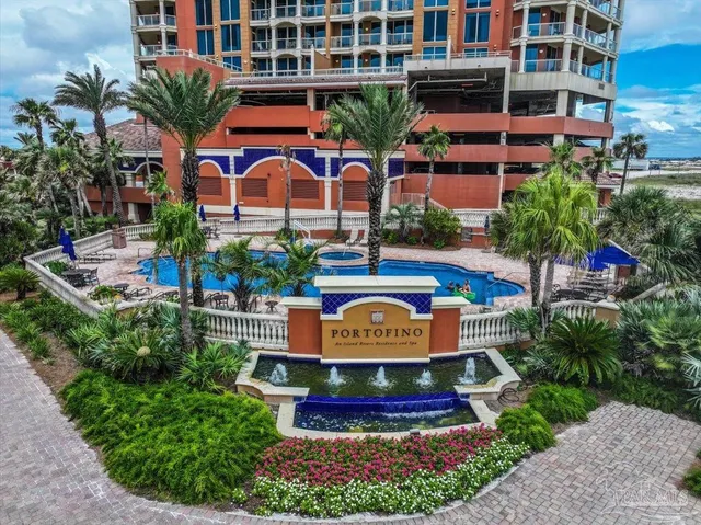 a view of swimming pool with outdoor seating and plants